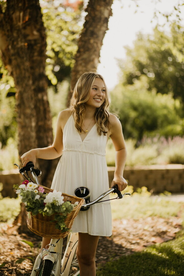 Girl with blonde hair and bike